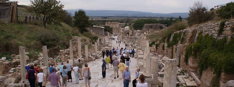 A guide leading guests through the marble streets of Ephesus